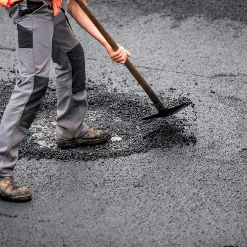 macadam worker on the road